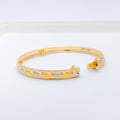 Elevated Two-Tone Alternating 22k Gold Oval Bangle