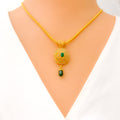 Mesmerizing Emerald Adorned 22k Gold Polki Pendant Set 