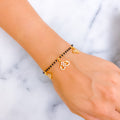 Magnificent Charmed 22k Gold Black Bead CZ Bracelet