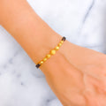 Reflective Striped 22k Gold Black Bead Bracelet