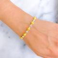 Gleaming High-Gloss 22k Gold Orb Two-Tone Bangle Bracelet
