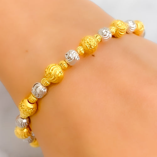 Gleaming High-Gloss 22k Gold Orb Two-Tone Bangle Bracelet