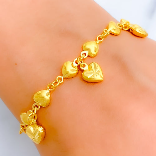 Tanishq 22 Karat Gold Bracelet with Flower and Leaf Charms