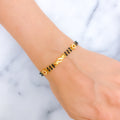 Dainty Leaf Accented 22k Gold CZ Black Bead Bracelet