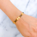 Elegant Bow 22k Gold Black Bead CZ Bracelet 