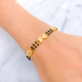 Elegant Bow 22k Gold Black Bead CZ Bracelet 