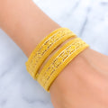 Graceful Lavish Striped 22k Gold Screw Bangles