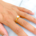 Glossy Leaf Adorned CZ Solitaire 22k Gold Ring
