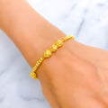 Fine Reflective Striped Orb 22k Gold Bracelet