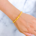 delightful-sand-finish-21k-gold-orb-bangle-bracelet