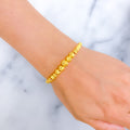 shimmering-graduating-21k-gold-bangle-bracelet