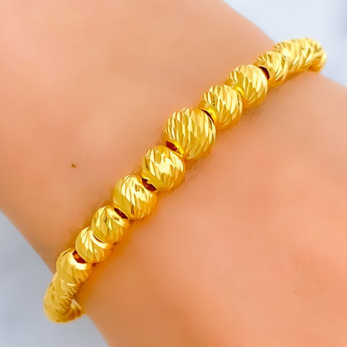 shimmering-graduating-21k-gold-bangle-bracelet