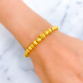 shimmering-graduating-21k-gold-bangle-bracelet
