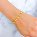 reflective-striped-orb-22k-gold-bracelet