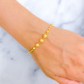 jazzy-triple-orb-22k-gold-bracelet