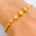 jazzy-triple-orb-22k-gold-bracelet