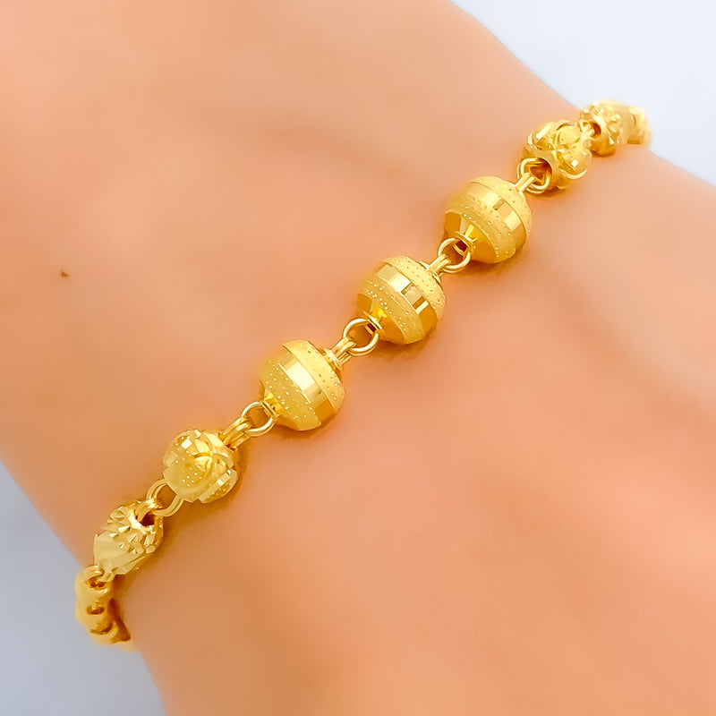 bold-striped-orb-22k-gold-bracelet