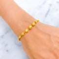 bold-striped-orb-22k-gold-bracelet