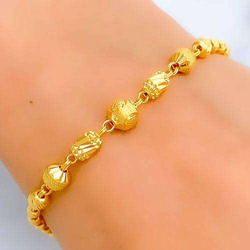 intricate-shiny-barrel-orb-22k-gold-bracelet