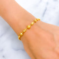 intricate-shiny-barrel-orb-22k-gold-bracelet