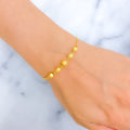 radiant-draped-22k-gold-orb-bolo-bracelet