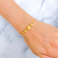 alternating-striped-22k-gold-orb-bolo-bracelet