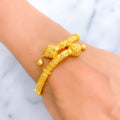 textured-festive-22k-gold-pipe-bangle