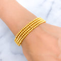 Bold Four Layered 22k Gold Bangle Bead Bracelet