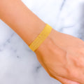 Graceful Wide Flat 21k Gold Bracelet