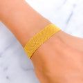 Graceful Wide Flat 21k Gold Bracelet