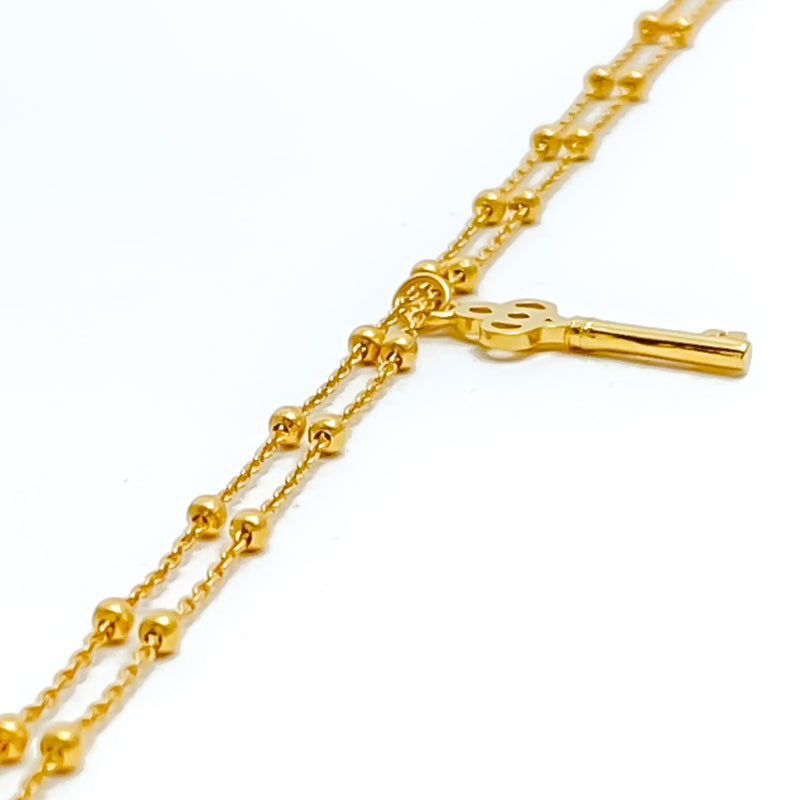 Charming Light-Weight 22K Gold Key Charm Bracelet