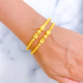 Ornate Striped Drum 22k Gold Pipe Bangles 