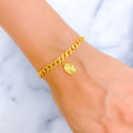 Ritzy Hanging Charm 21k Gold Bracelet 