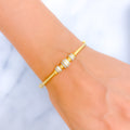 Elegant Two-Tone Orb 22k Gold Bangle Bracelet
