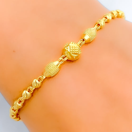 Elongated Crossed Orb 22k Gold Bracelet