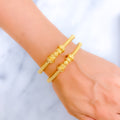 Delightful Flower Accented 22k Gold Pipe Bangles 