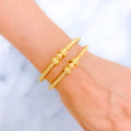 Lovely Flower Adorned 22k Gold Pipe Bangles 