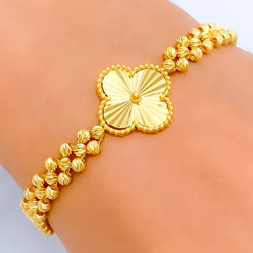 elevated-fancy-22k-gold-clover-bracelet