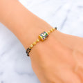 Fancy Floral 22k Gold Black Bead Bracelet 