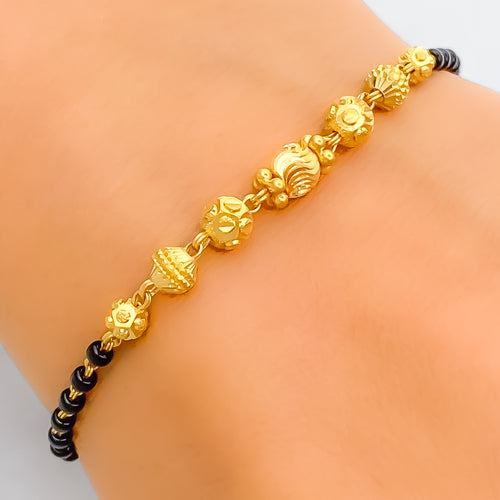 Versatile Wavy orb 22k Gold Black Bead Bracelet