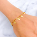 plush-charming-22k-gold-charm-bracelet