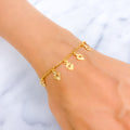 dangling-detailed-22k-gold-charm-bracelet