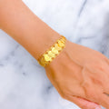 lustrous-engraved-21k-gold-coin-bracelet