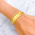 lustrous-engraved-21k-gold-coin-bracelet