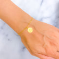 rich-vibrant-21k-gold-coin-bracelet