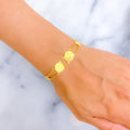 radiant-graceful-21k-gold-coin-bracelet