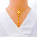 elevated-clover-tassel-22k-gold-necklace