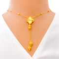 elevated-clover-tassel-22k-gold-necklace