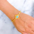 Bold Poised 21k Gold Floral Bangle Bracelet