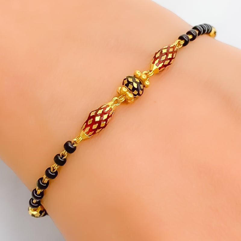 Radiant Polished 22k Gold Black Bead Bracelet